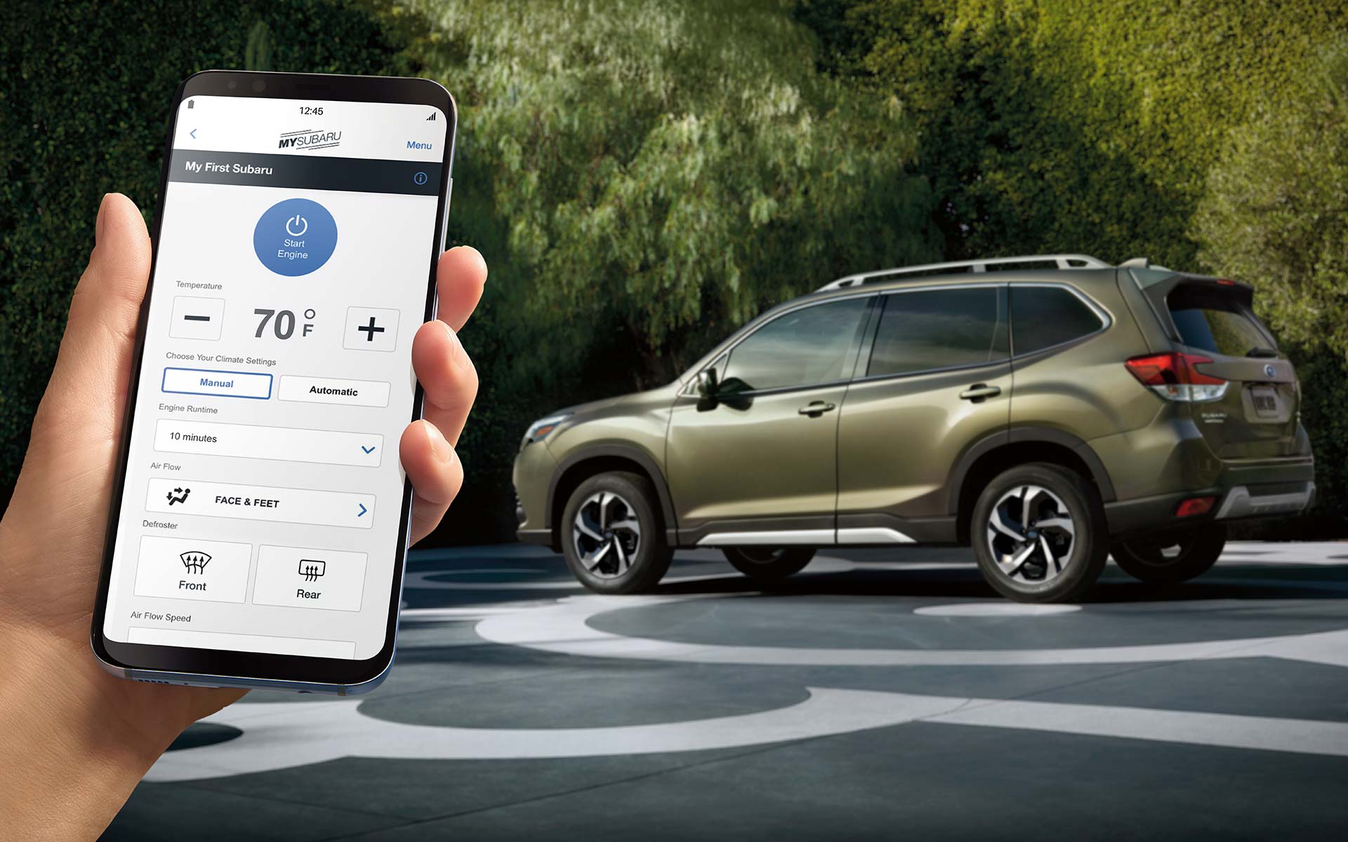 A close-up of a phone showing the Remote Engine Start with Climate Control feature of SUBARU STARLINK® Safety and Security available on the 2022 Forester.