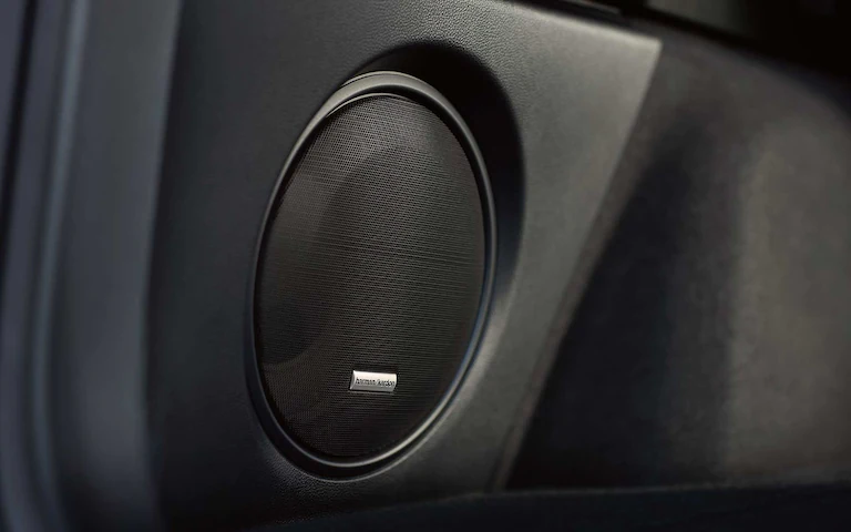 A close-up of one of the speakers in the Harman Kardon premium audio system available on the 2022 Subaru Outback.