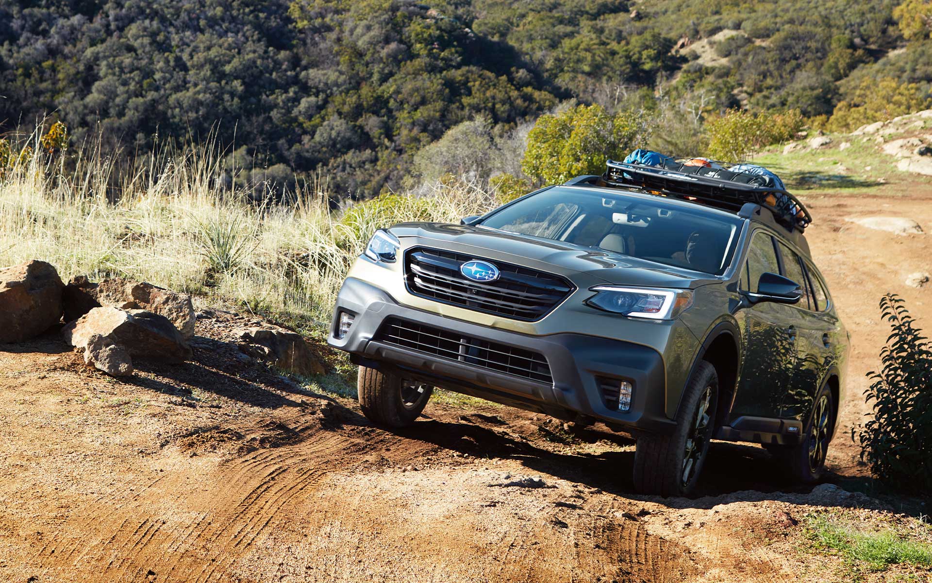 A 2022 Subaru Onyx Edition XT climbing a steep dirt road.