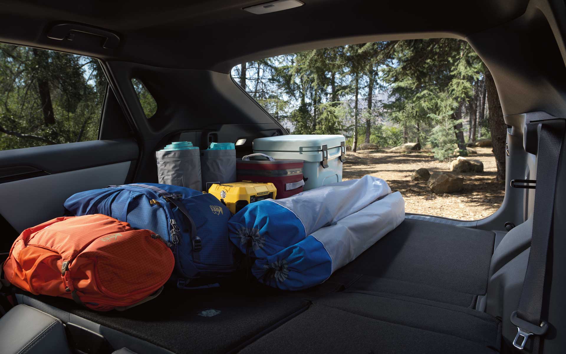 A view of the rear cargo area with rear seat back folded down in the 2023 Solterra.